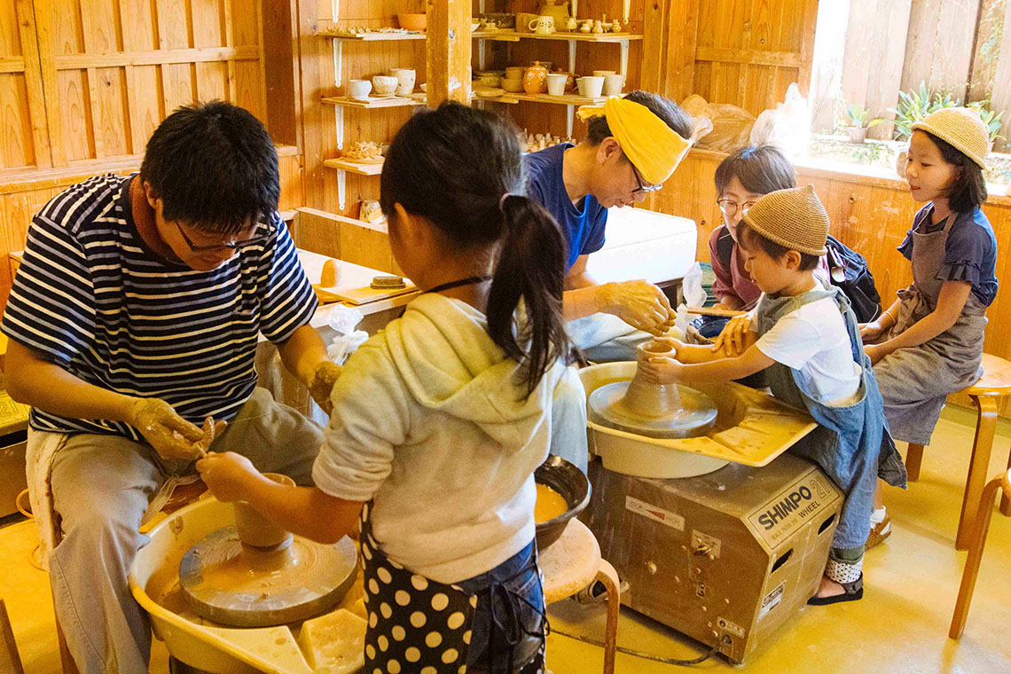 shelves of yachimun pottery items